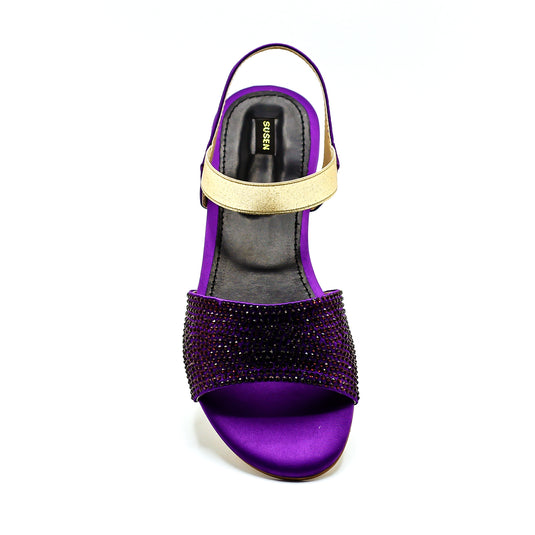 Swiss F1 women’s flat sandals with ankle strap for a modern look.